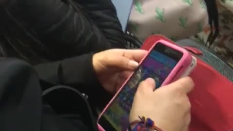 Woman falls asleep on phone on bus