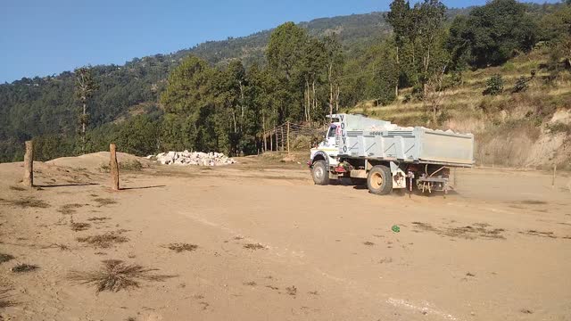 Truck unloading stone.