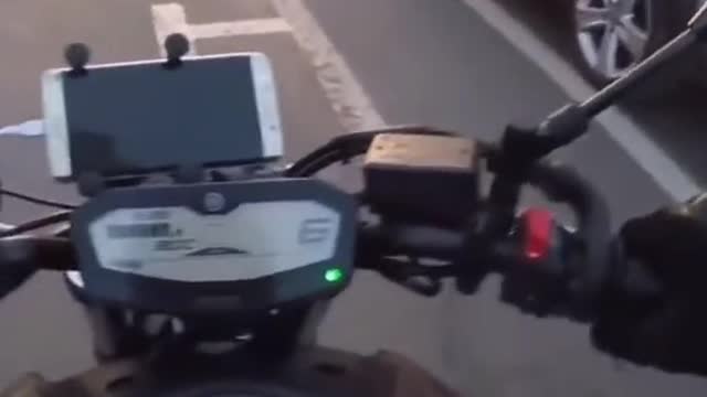 Guy almost cuts off bike, then gets instant carma