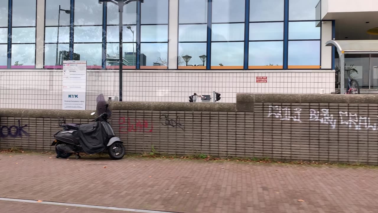 Filming the other side of the street along the way to Amsterdam Centraal