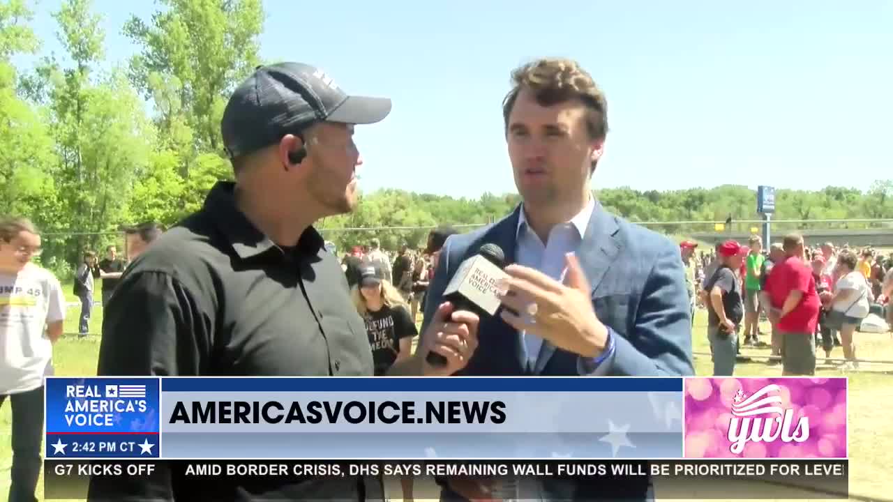 Charlie Kirk talks with Ben Bergquam at the MAGAFRANK rally