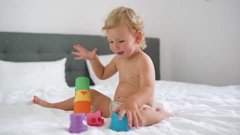 Young Little Kid Playing with his Toys