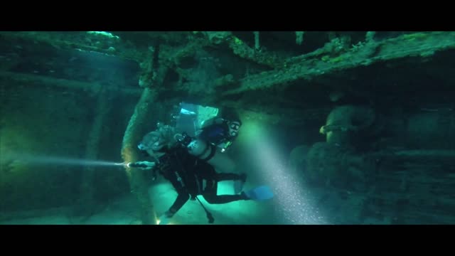 diving crew just Explores under the water