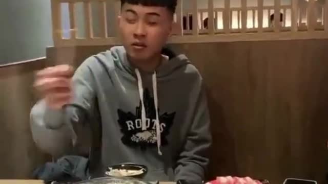 Boy showing talent in restaurant