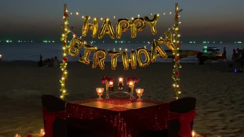 Surprise birthday celebration on the beach sand