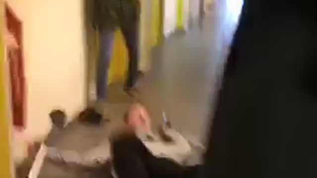 Guy tries to handstand on crutches and falls onto floor