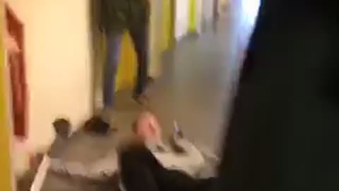 Guy tries to handstand on crutches and falls onto floor