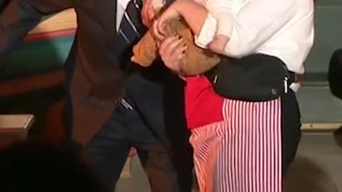 Biden playfully bites babies