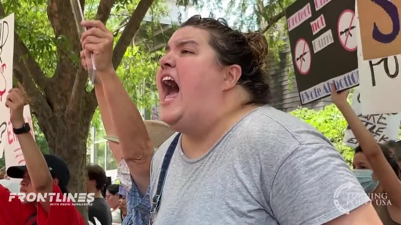 People scream "murderers" outside the NRA convention
