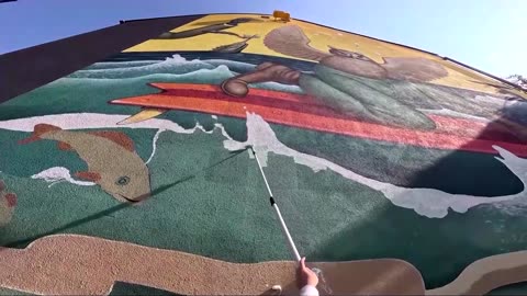 World-renowned artist creates wartime murals in Ukraine's Kyiv