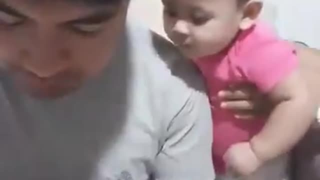 Cute little girl wants his father's food