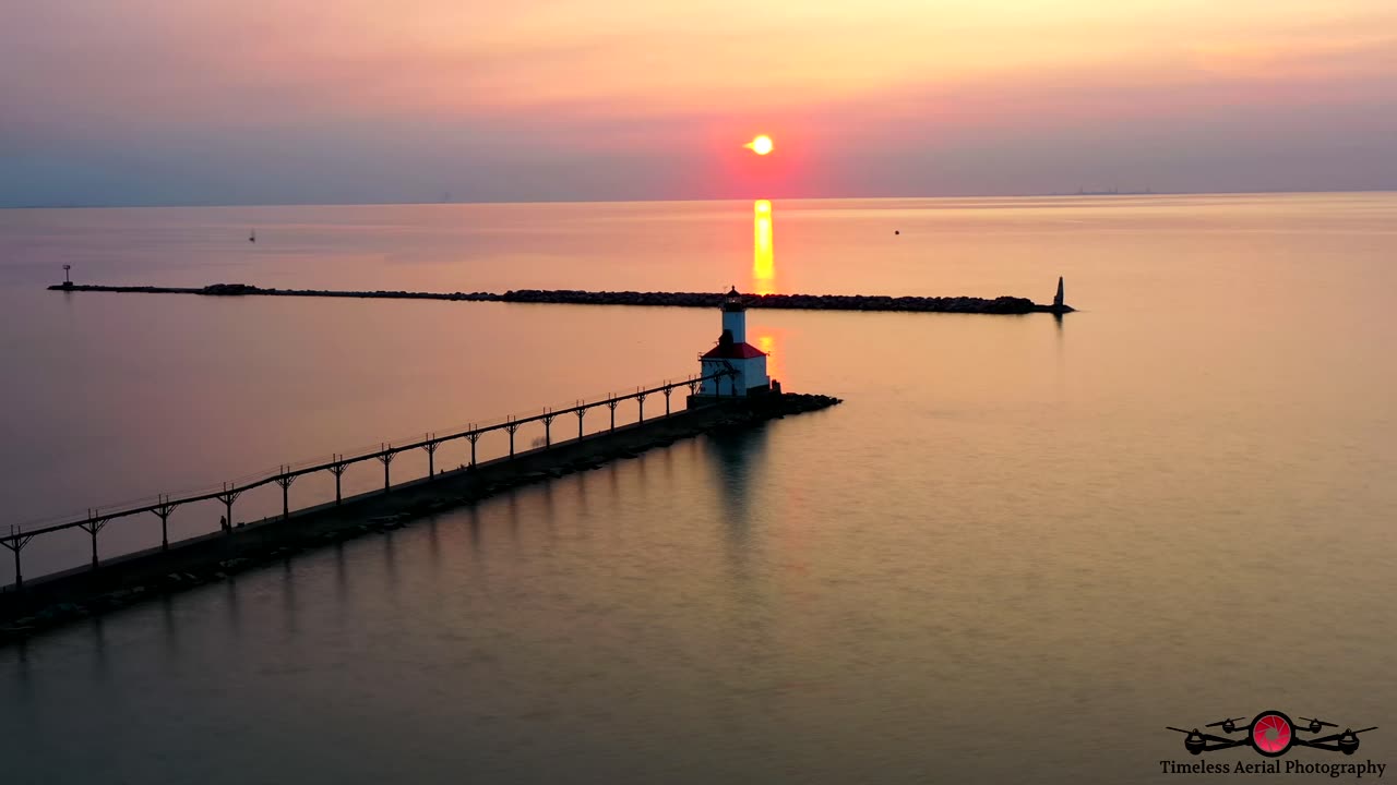 Sunset Hyper-Lapse Over Michigan City Lighthouse 4K Drone Footage