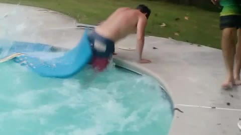 Man runs on top of boogie boards in a pool