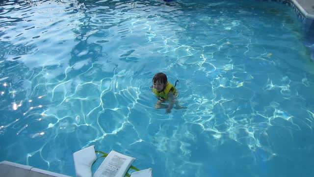 Little Girl learning to Doggy Paddle