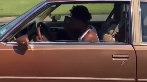 NBA Young Boy Driving and Pointing Gun Out of Window in Baton Rouge