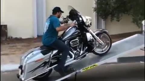 Loading motorcycle into truck