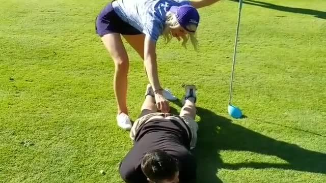 Girl golfs off mans butt