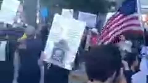 Anti-vaccine protesters rally outside the news