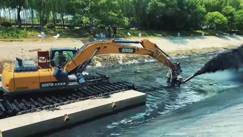 Amphibious Excavator Carries Cutter Suction Pump - A Powerful Tool for River Dredging