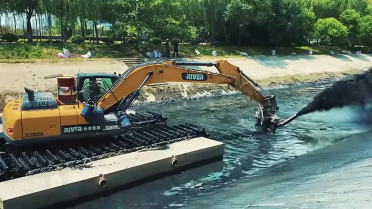 Amphibious Excavator Carries Cutter Suction Pump - A Powerful Tool for River Dredging