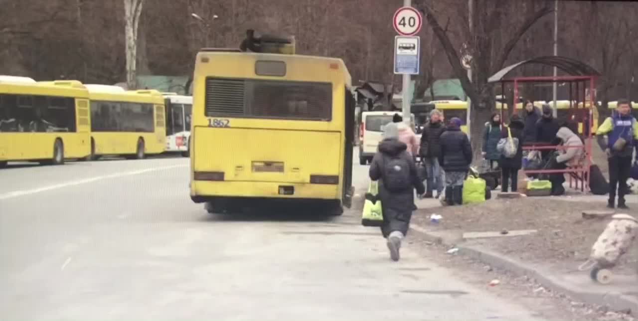 Ukrainian citizens crossing the checkpoint as they escaping from the Russian shelled west Kyiv