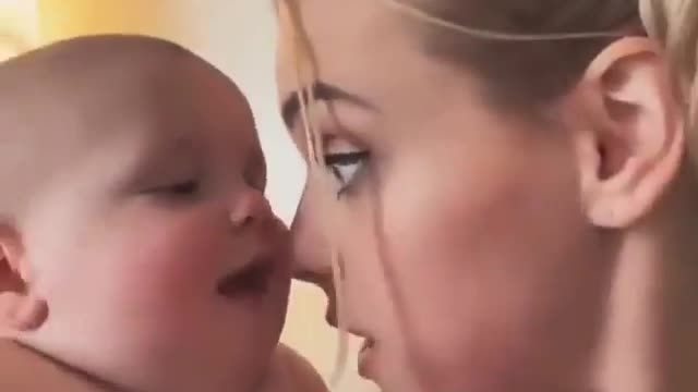 Cute baby kiss mom