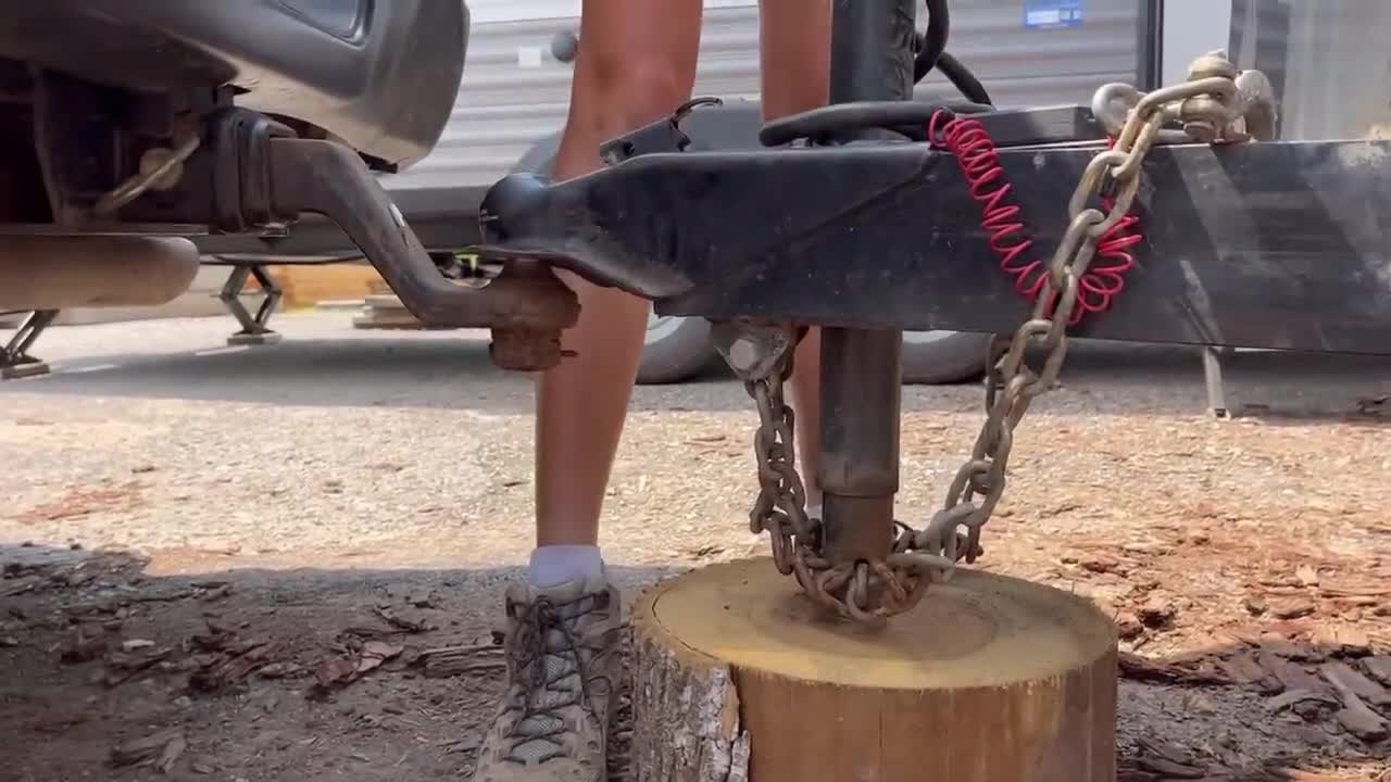 Pickup truck pulling loaded firewood cargo box