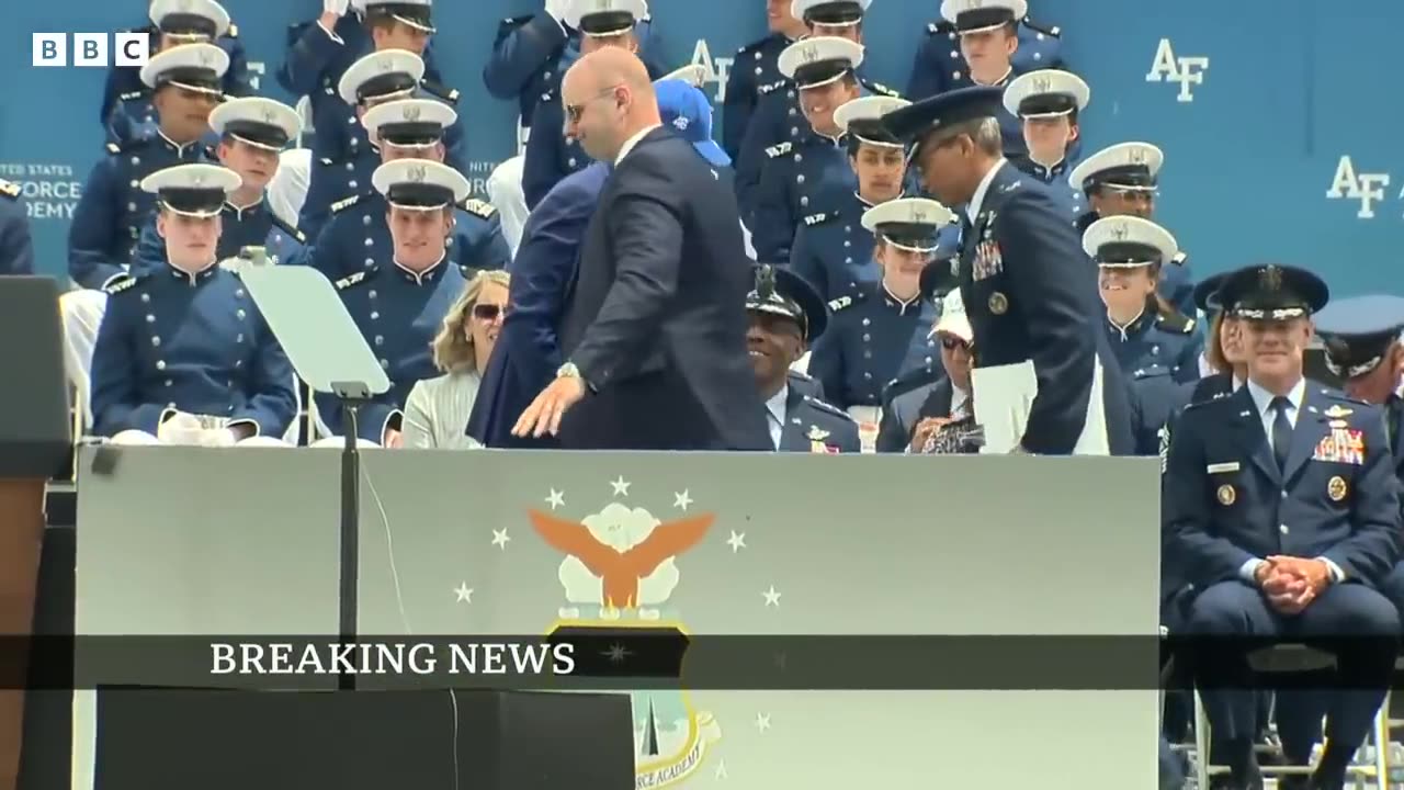 US President Biden trips and falls over at graduation event – BBC News