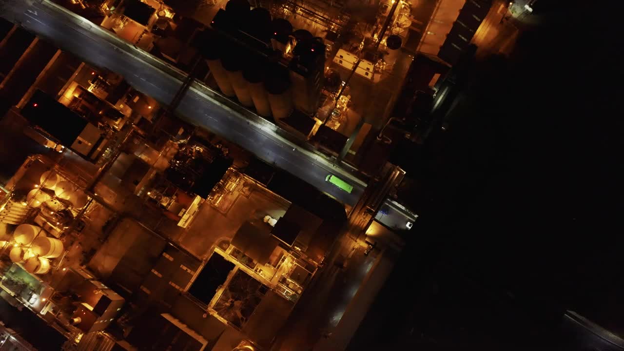 Top aerial view of a factory during night time