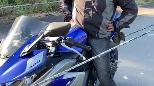 Powerlines Fall Around Motorcyclist