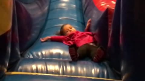 Collab copyright protection - kid in pink falling down slide