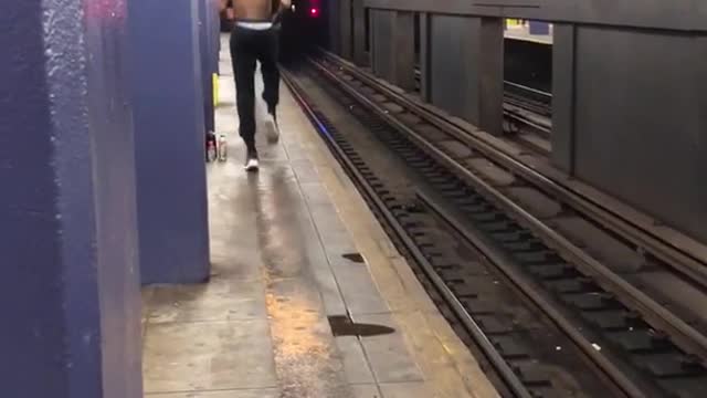 Shirtless man running in place exercising