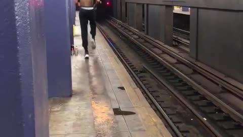 Shirtless man running in place exercising