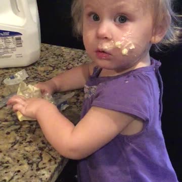 Young Girl Slathers Butter All Over Her Face