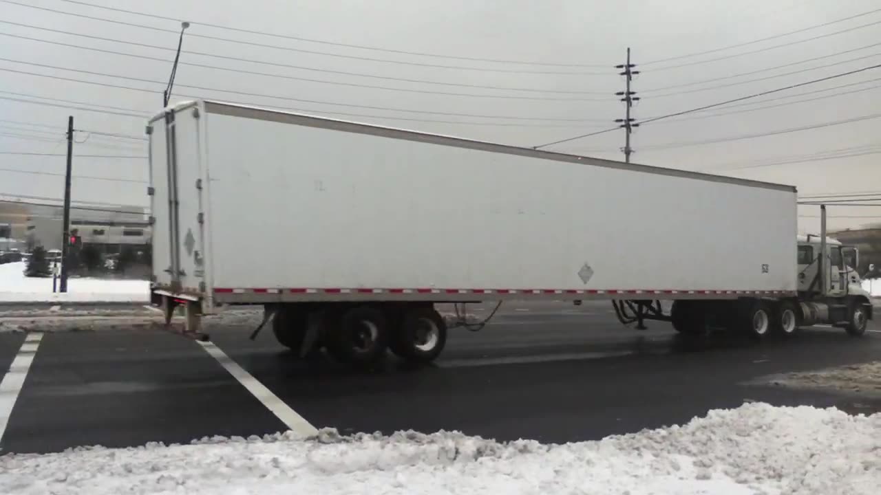 DEATH DEFYING WALK IN VICIOUS SNOWBLAST TRAFFIC