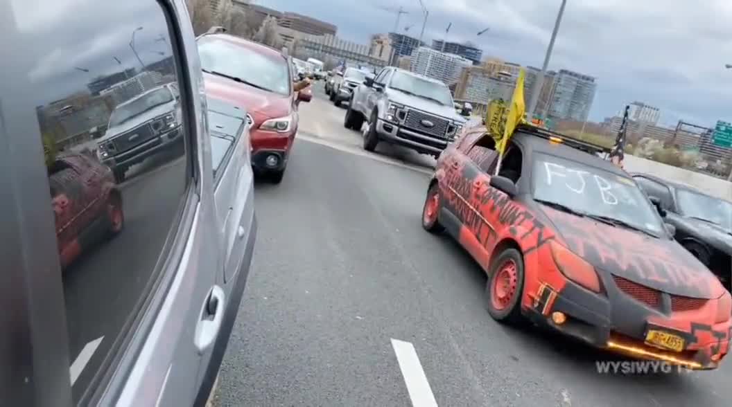 ore hatred for the Peoples Convoy as a man flips off participants