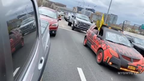 ore hatred for the Peoples Convoy as a man flips off participants