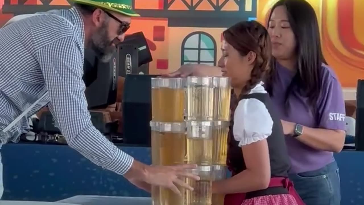 Girl embraces disaster at Oktoberfest stein carrying contest 🍻💦