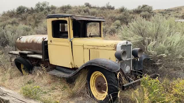 Abandoned Vintage Car on the Open Field