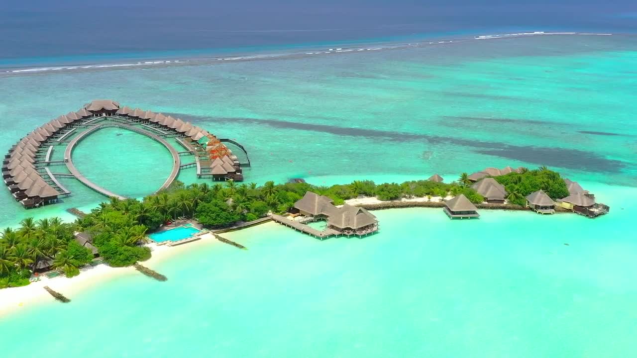 Paradise beach with bungalows over the sea