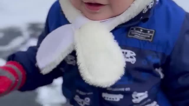 Japanese Child playing in the snow for the first time