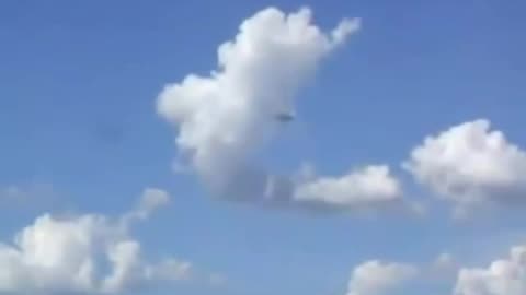 UFO hides behind cloud