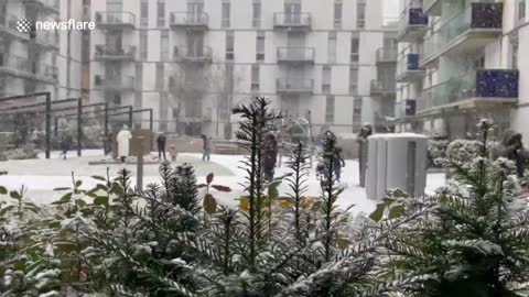 Children enjoy snow in London amid weather warning for much of UK