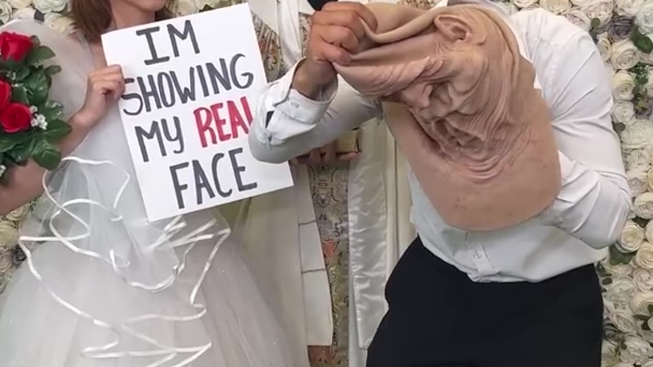 Husband shows his face for the first time to her wife.