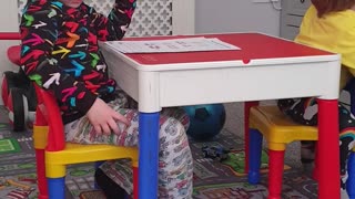 Siblings Tussle over Table