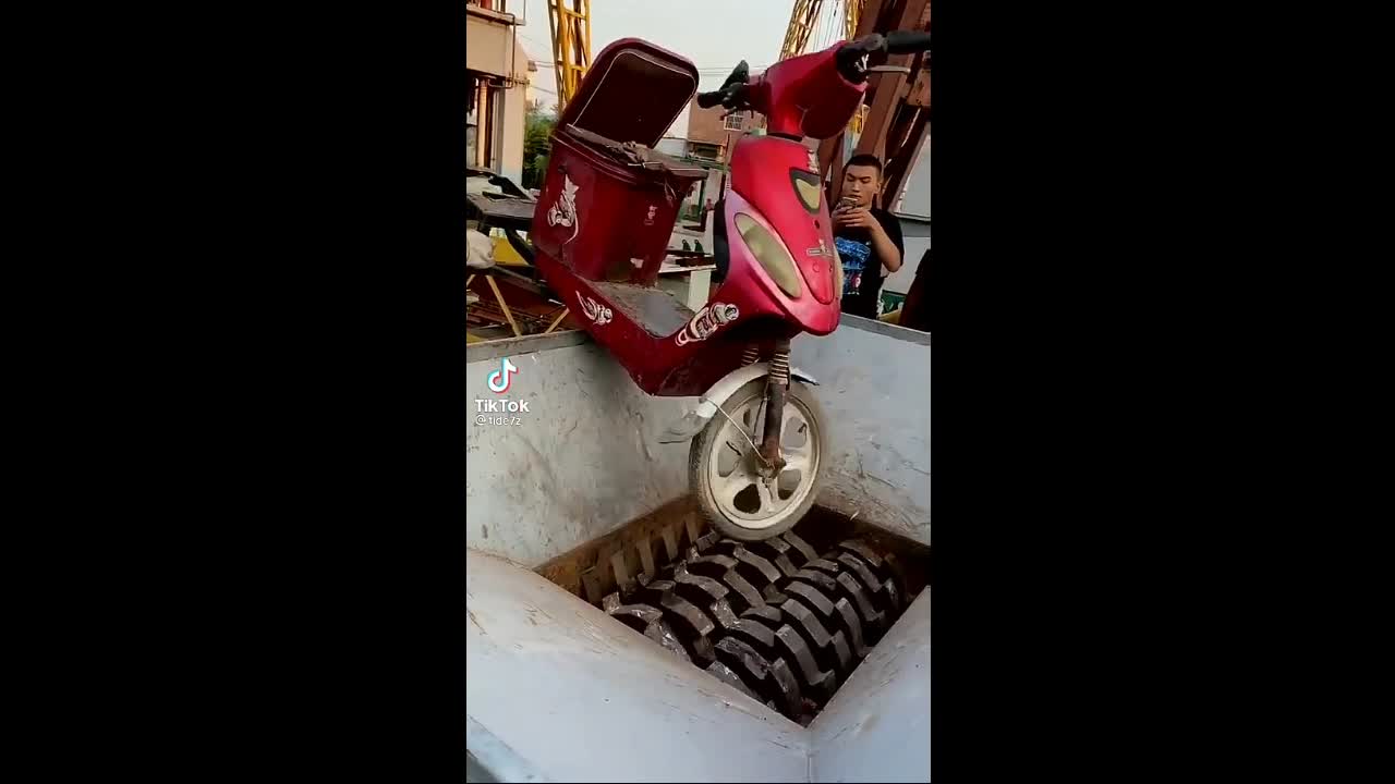 Crushing machine against a motorcycle