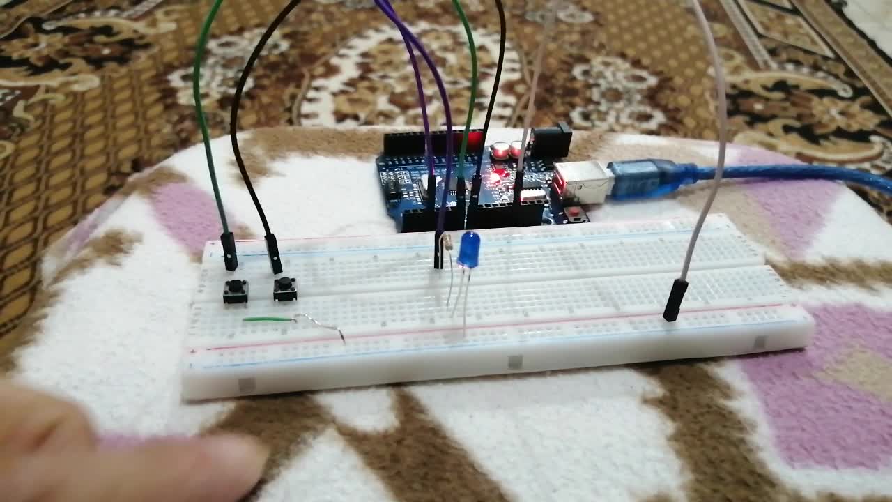 Electric circuit consisting of two instant buttons and a lamp