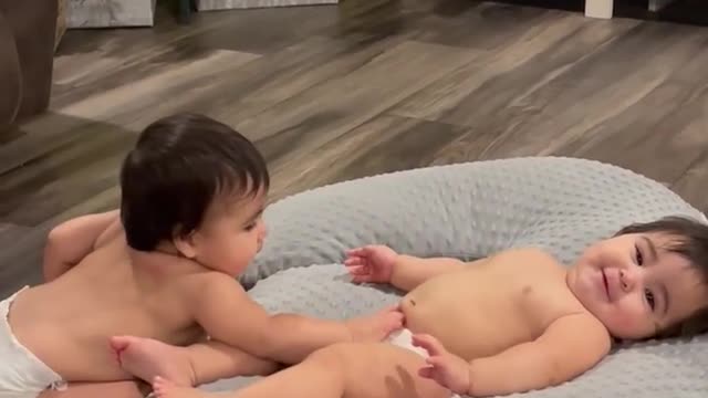 Cute baby love each other