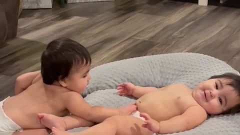 Cute baby love each other