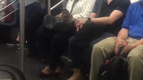 Sunglasses and tie guy dances in subway